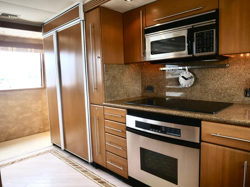 Slide: The Image of Modern kitchen in a 2000 Westport 112 yacht with stainless steel appliances. - 17