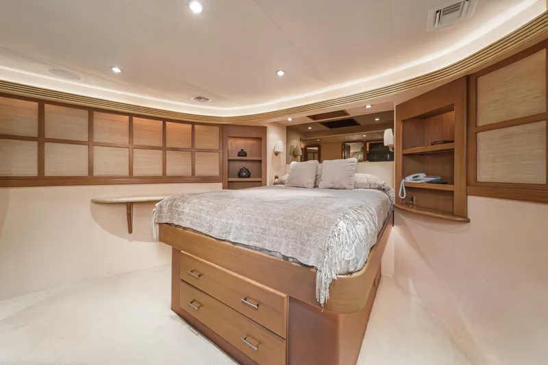 Slide: The Image of Luxurious bedroom interior of 2000 Westport 112 yacht with modern design and ample storage. - 29