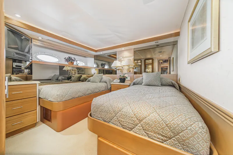 Slide: The Image of Luxurious twin bedroom in a 2000 Westport 112 yacht with modern decor. - 32