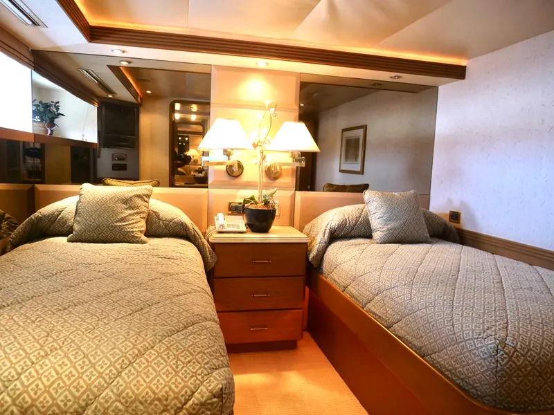 Slide: The Image of Luxurious twin bedroom on a 2000 Westport 112 yacht with elegant decor. - 33
