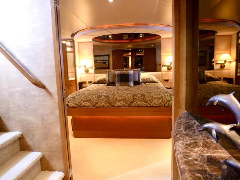 Slide: The Image of Luxurious master bedroom on a 2000 Westport 112 yacht with elegant decor. - 34