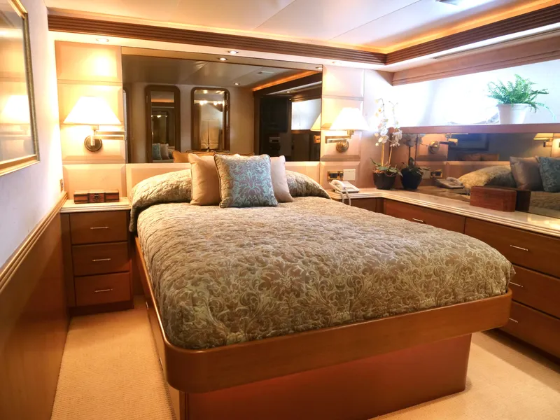 Slide: The Image of Luxurious bedroom in a 2000 Westport 112 yacht with elegant decor and ample storage. - 37