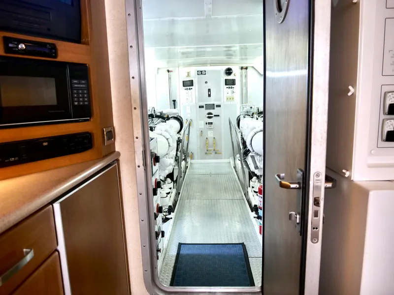 Slide: The Image of Engine room of a 2000 Westport 112 yacht, viewed through an open door. - 40