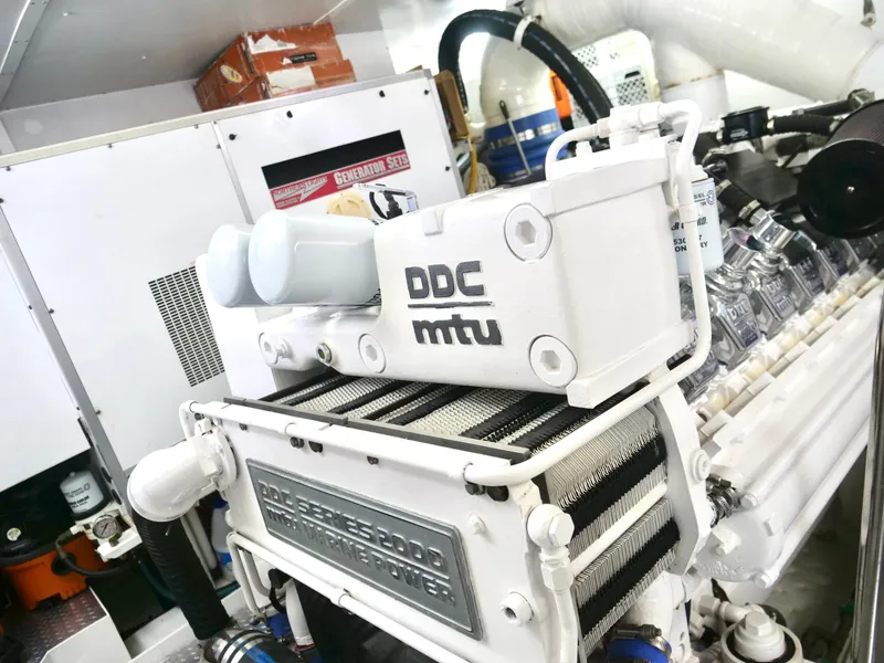 Slide: The Image of Engine room of a 2000 Westport 112 yacht featuring a DDC MTU engine. - 41