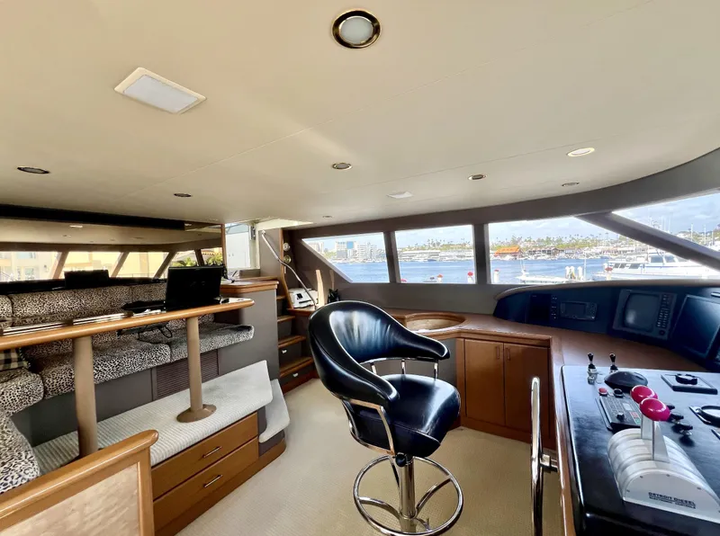 Slide: The Image of Luxurious interior of 2000 Westport 112 yacht with helm and seating area. - 5