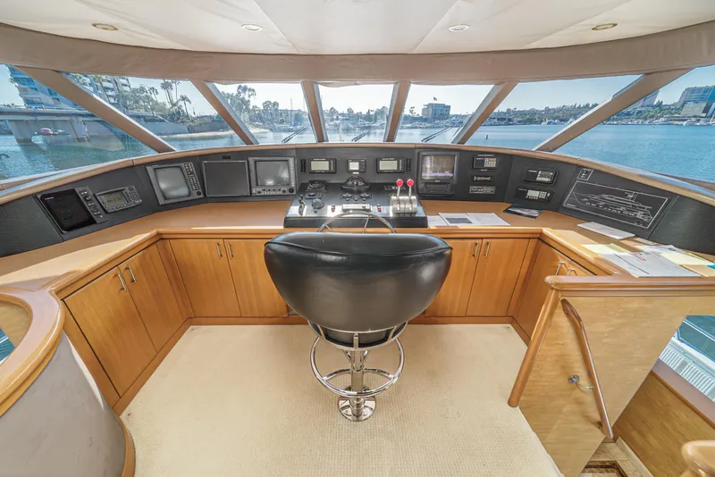 Slide: The Image of 2000 Westport 112 yacht helm station with panoramic windows and modern navigation equipment. - 6