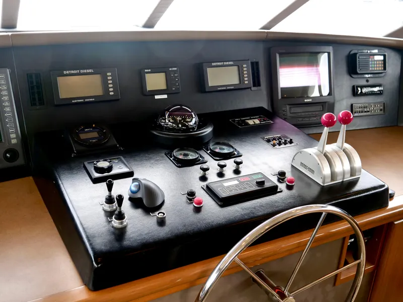 Slide: The Image of Westport 112 yacht helm station with navigation controls and instruments, year 2000 model. - 7