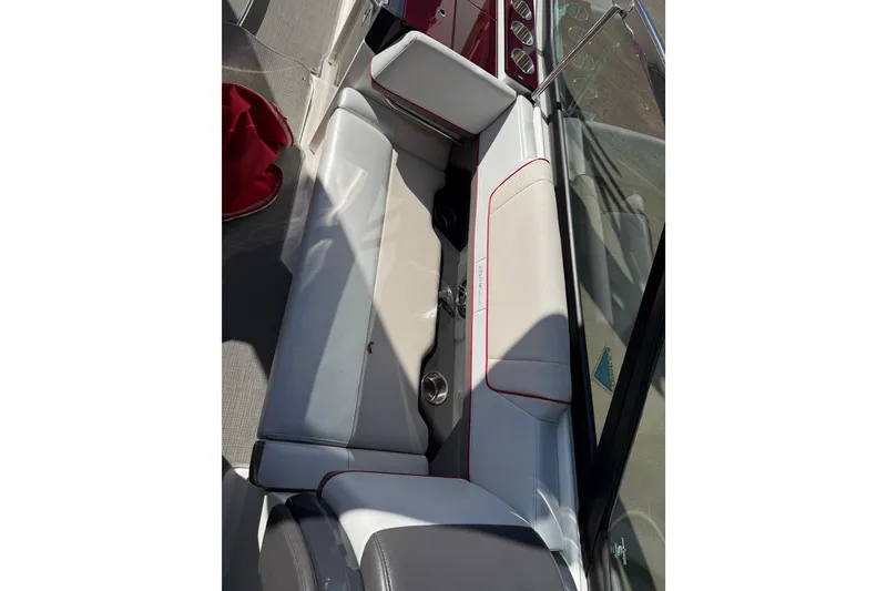Slide: The Image of 2019 Formula 330 Crossover Bowrider cockpit with cup holders and storage compartment. - 11