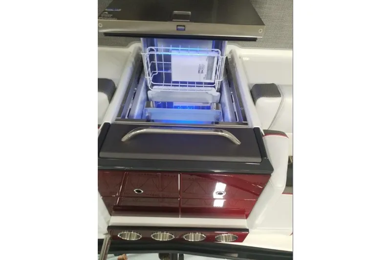 Slide: The Image of 2019 Formula 330 Crossover Bowrider in a showroom, featuring sleek red and white design. - 3