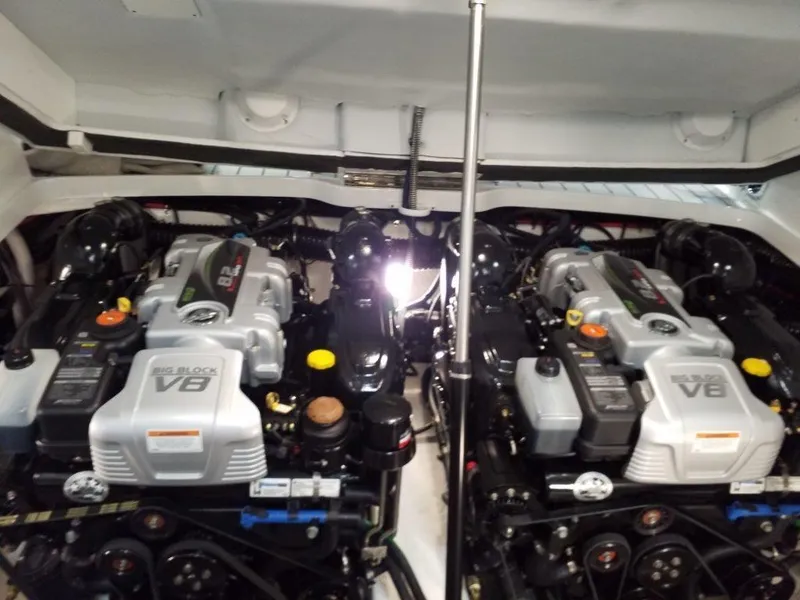 Slide: The Image of 2019 Formula 330 Crossover Bowrider dashboard with red steering wheel and Mercury controls. - 4