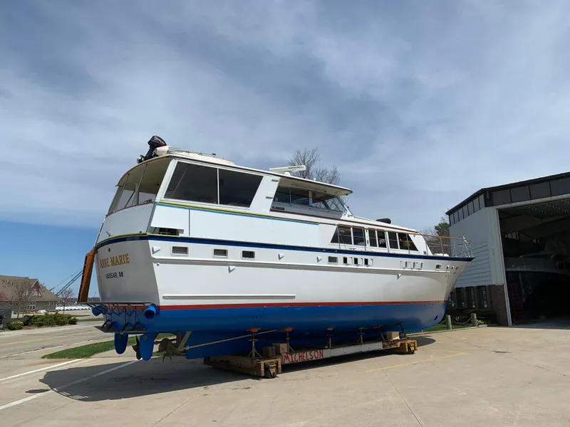 The Image of 1971 Matthews 56 Motor Yacht on dry dock, showcasing classic design and structure. - 0