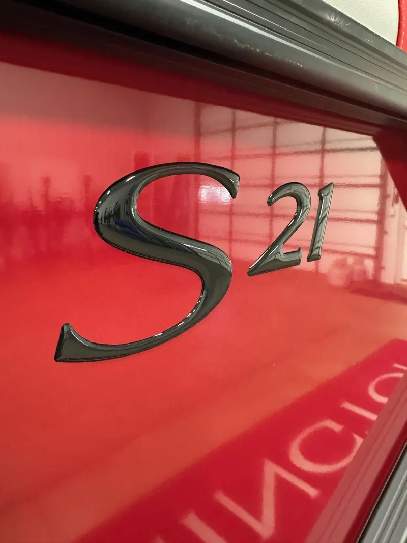 Slide: The Image of 2025 Bennington 21 SSR Quad Bench, red exterior with "S 21" emblem. - 3