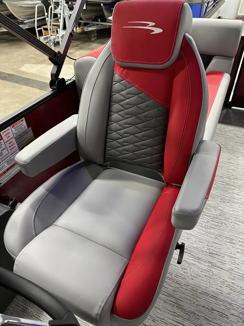 Slide: The Image of 2025 Bennington 21 SSR Quad Bench boat seat, red and gray upholstery, modern design. - 32