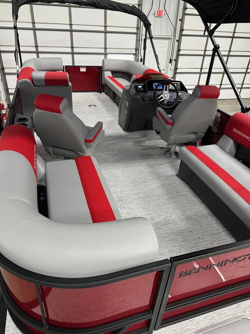 Slide: The Image of 2025 Bennington 21 SSR Quad Bench pontoon boat interior with red and gray seating. - 37
