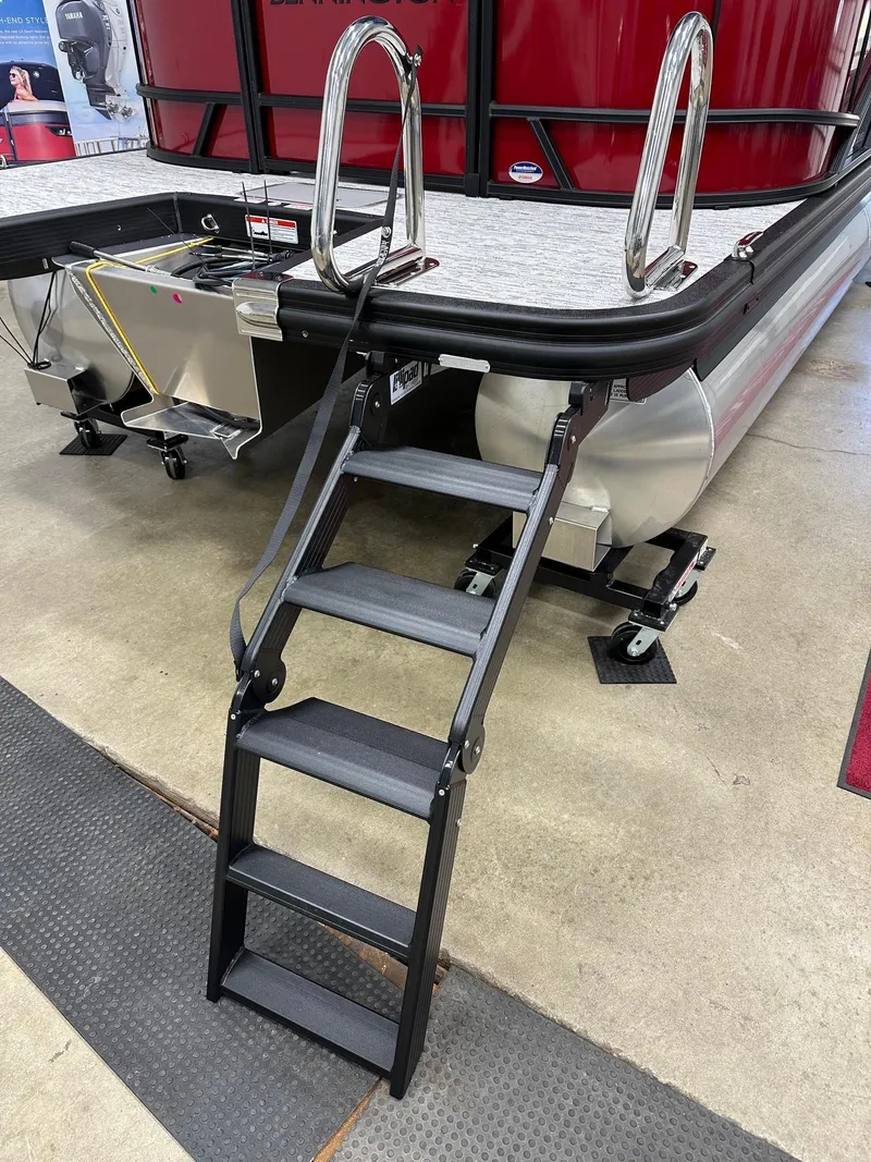 Slide: The Image of 2025 Bennington 21 SSR Quad Bench pontoon boat with foldable boarding ladder. - 5