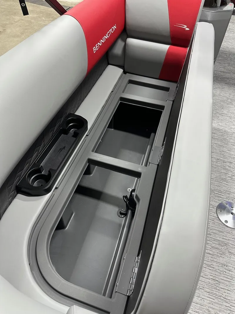 Slide: The Image of 2025 Bennington 21 SSR Quad Bench with open storage compartment and cup holders. - 6