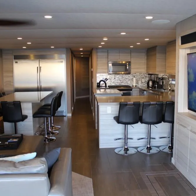 Slide: The Image of Modern kitchen interior in Adonia Atlantis Trip 8, 2016 model, featuring sleek design and bar seating. - 11