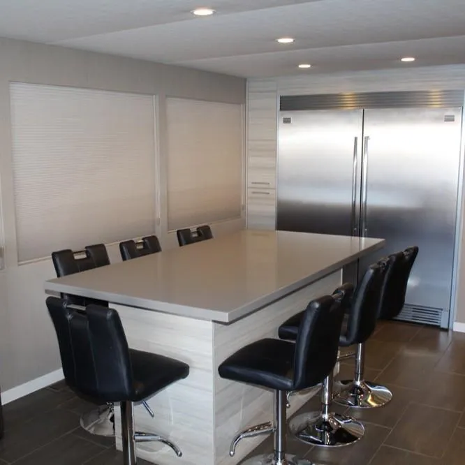 Slide: The Image of Modern kitchen with sleek island, black chairs, and stainless steel appliances, Adonia Atlantis Trip 8, 2016. - 14