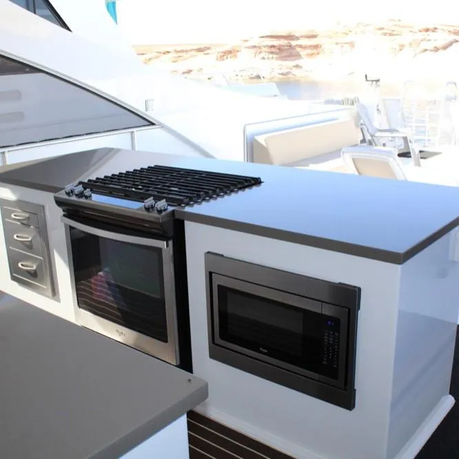 Slide: The Image of Outdoor kitchen on Adonia Atlantis Trip 8 yacht, featuring oven and microwave, 2016 model. - 9