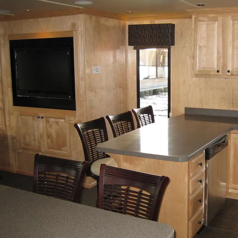 Slide: The Image of Interior of 2009 Sumerset Stargazer Trip 10 houseboat with modern kitchen and dining area. - 11