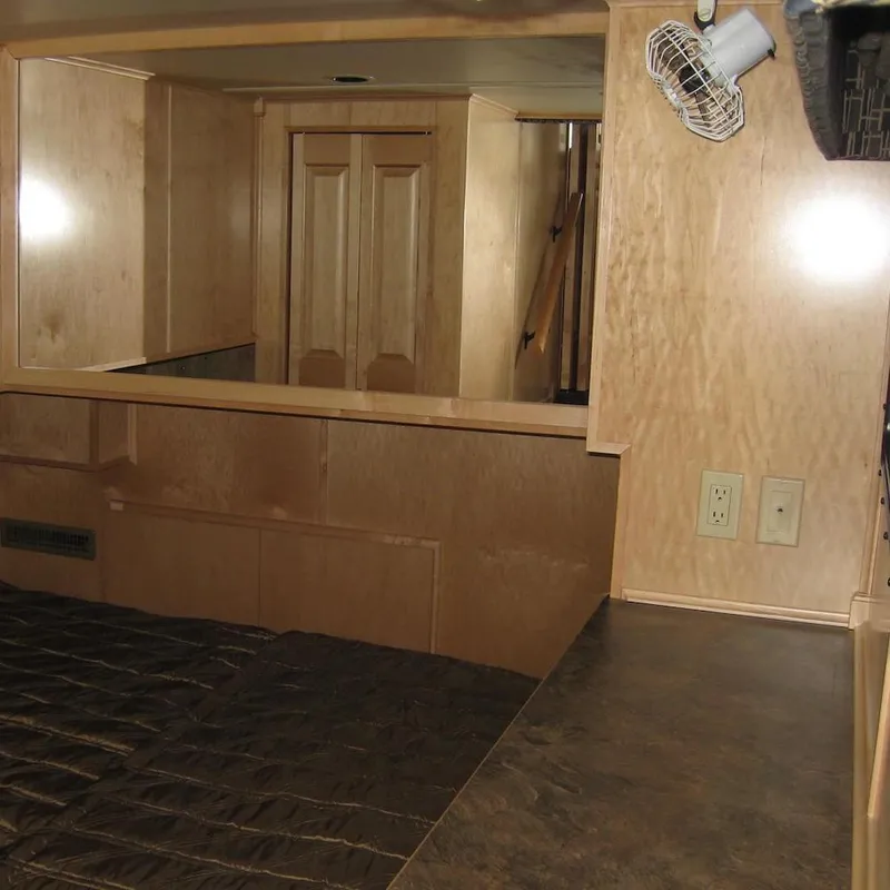 Slide: The Image of Interior of 2009 Sumerset Stargazer Trip 10 houseboat with wood paneling and outlets. - 13