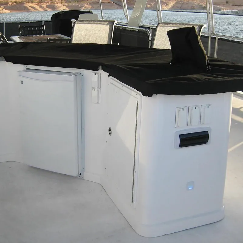 Slide: The Image of Outdoor boat kitchen area on a 2009 Sumerset Stargazer Trip 10, featuring a mini fridge. - 18