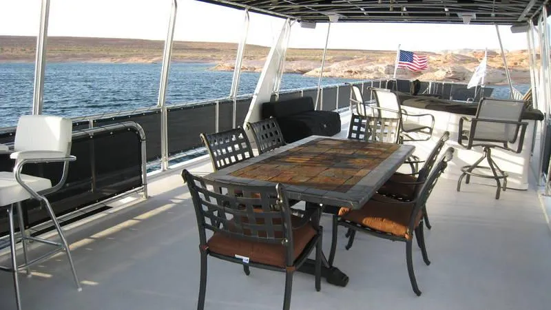 Slide: The Image of Spacious deck of 2009 Sumerset Stargazer Trip 10 houseboat with outdoor seating and scenic water view. - 7