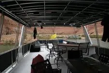 Slide: The Image of 2009 Sumerset Stargazer Trip 10 houseboat interior with chairs and table, scenic river view. - 8