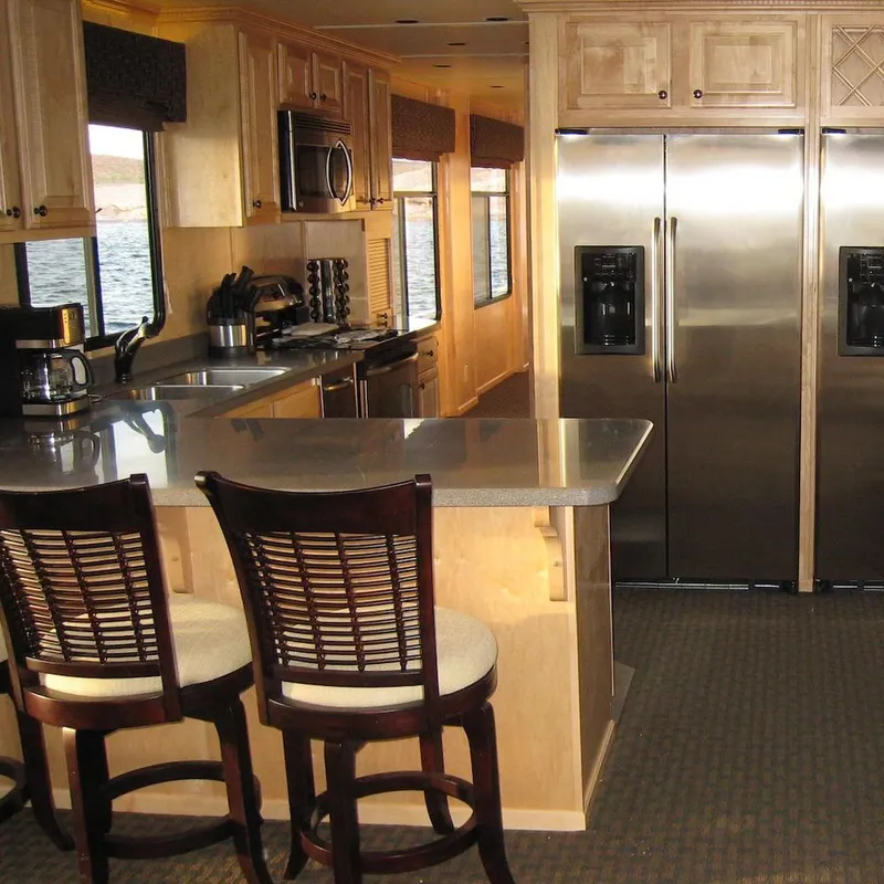 Slide: The Image of Luxurious kitchen interior of 2009 Sumerset Stargazer Trip 10 houseboat with modern appliances. - 9