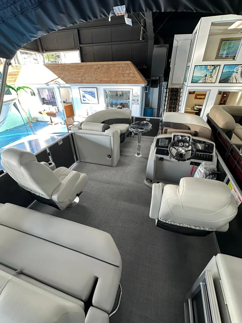 Slide: The Image of Luxurious interior of 2025 Sylvan Mirage 8520 CLZ DH pontoon boat, featuring plush seating and modern helm. - 10