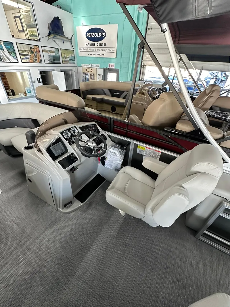 Slide: The Image of 2025 Sylvan Mirage 8520 CLZ DH pontoon boat interior with modern helm and seating. - 12