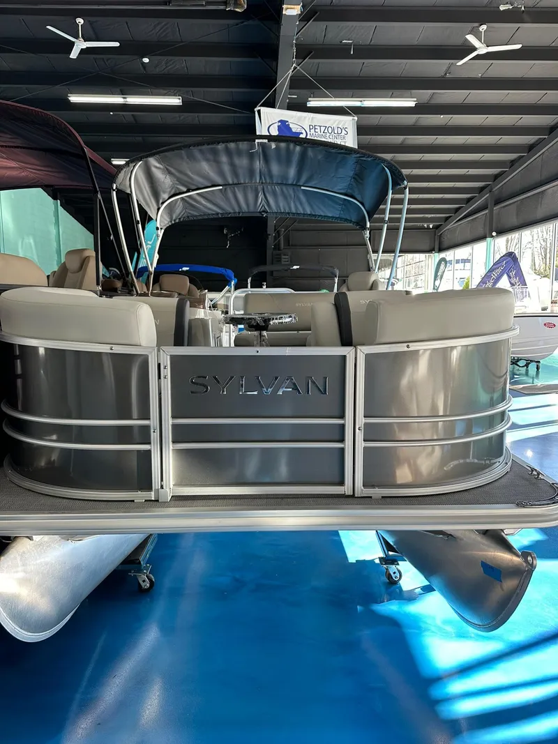 Slide: The Image of 2025 Sylvan Mirage 8520 CLZ DH pontoon boat in showroom. - 2