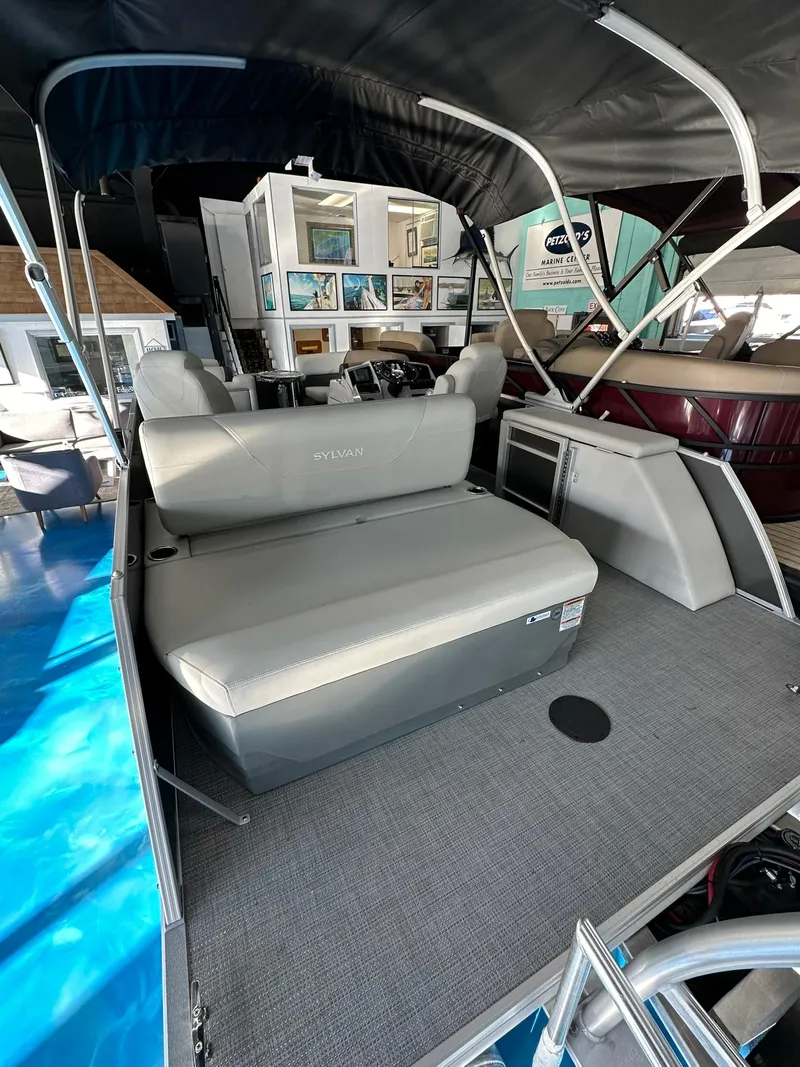 Slide: The Image of 2025 Sylvan Mirage 8520 CLZ DH pontoon boat interior with seating and helm. - 5