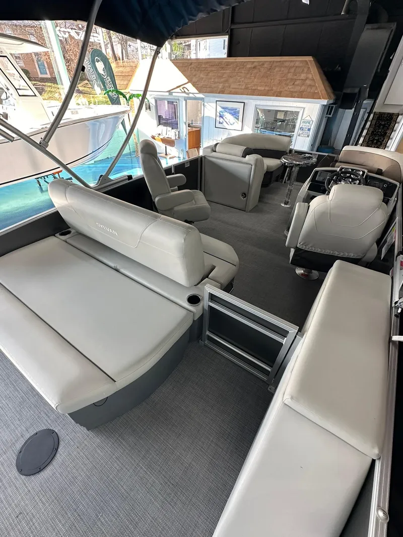 Slide: The Image of 2025 Sylvan Mirage 8520 CLZ DH pontoon boat interior with luxurious seating and modern design. - 6
