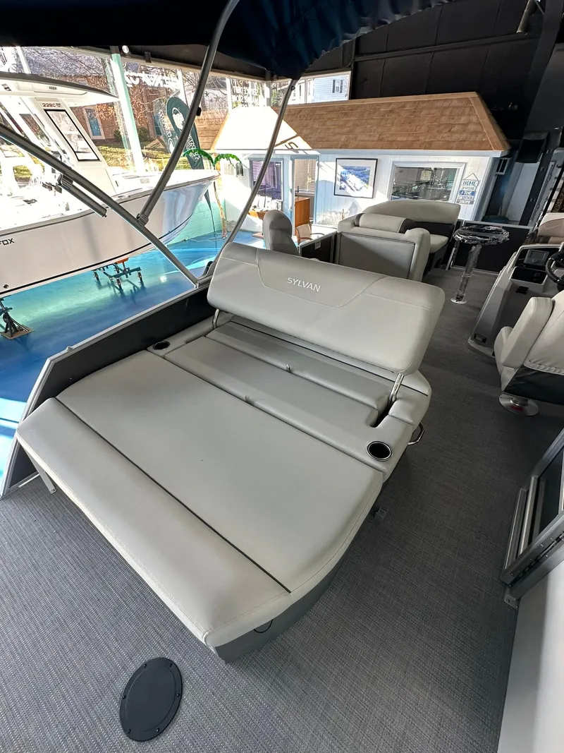 Slide: The Image of 2025 Sylvan Mirage 8520 CLZ DH pontoon boat interior with plush seating. - 7