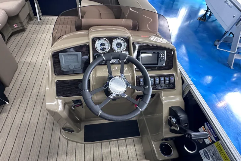 Slide: The Image of Steering console of 2026 Sylvan Mirage 8522 LZ pontoon boat with modern controls and gauges. - 20