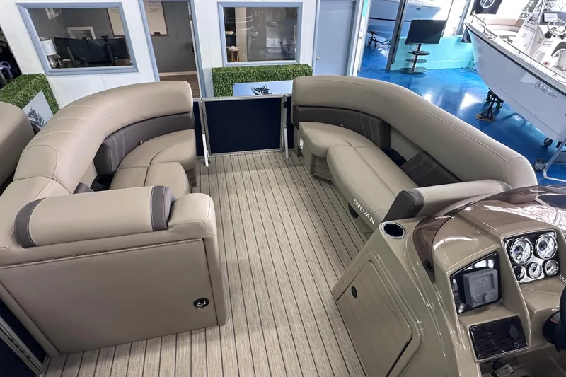 Slide: The Image of Luxurious interior of 2026 Sylvan Mirage 8522 LZ pontoon boat with plush seating and modern dashboard. - 23