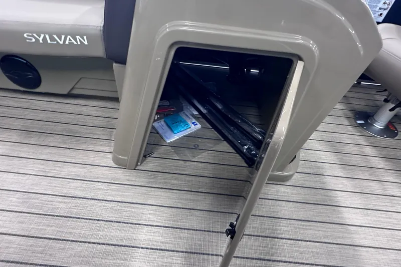 Slide: The Image of Open storage compartment on 2026 Sylvan Mirage 8522 LZ boat, showing interior details. - 24