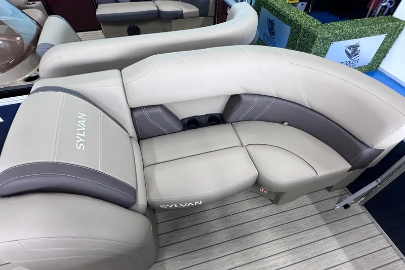 Slide: The Image of Luxurious seating on 2026 Sylvan Mirage 8522 LZ pontoon boat, featuring elegant beige upholstery. - 27