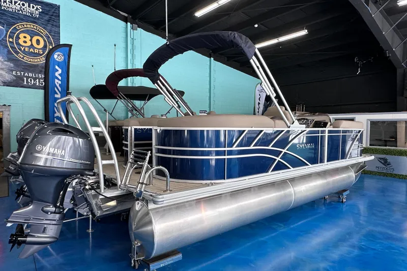 Slide: The Image of 2026 Sylvan Mirage 8522 LZ pontoon boat with Yamaha engines in showroom. - 4