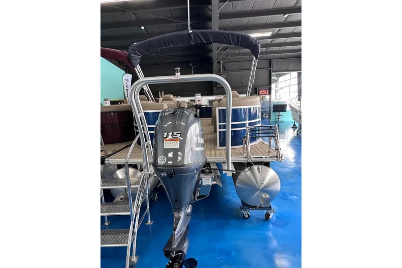 Slide: The Image of 2026 Sylvan Mirage 8522 LZ pontoon boat with 115 HP outboard motor in showroom. - 5