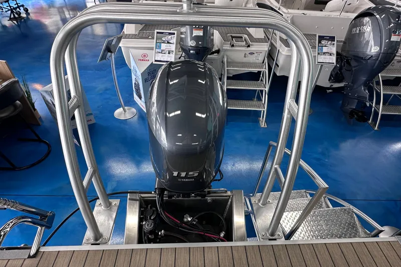 Slide: The Image of 2026 Sylvan Mirage 8522 LZ with Yamaha 115 outboard motor in showroom. - 7