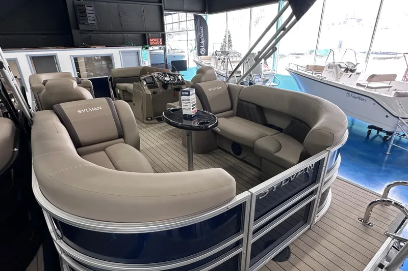 Slide: The Image of Luxurious interior of 2026 Sylvan Mirage 8522 LZ pontoon boat with plush seating. - 8