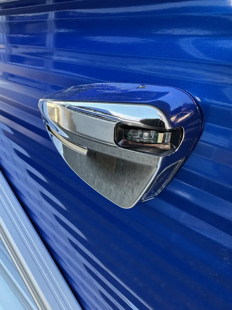 Slide: The Image of Chrome detail on 2025 Bennington 168 SL boat against blue background. - 13
