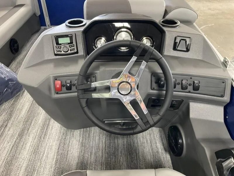 Slide: The Image of 2025 Bennington 168 SL boat dashboard with steering wheel and control panel. - 16