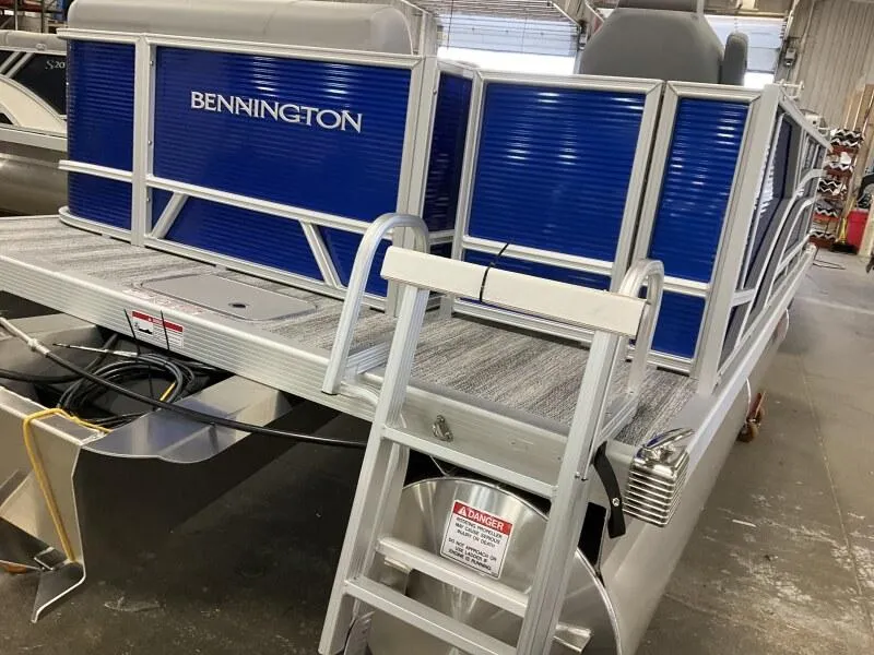 Slide: The Image of 2025 Bennington 168 SL pontoon boat with blue panels and ladder in stock. - 19