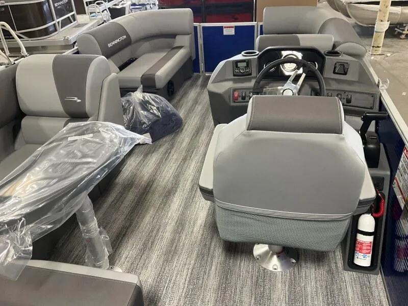 Slide: The Image of 2025 Bennington 168 SL pontoon boat interior with gray seating and steering console. - 20