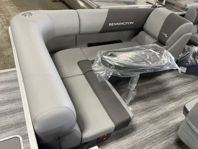 Slide: The Image of 2025 Bennington 168 SL pontoon boat interior with gray seating and table. - 21