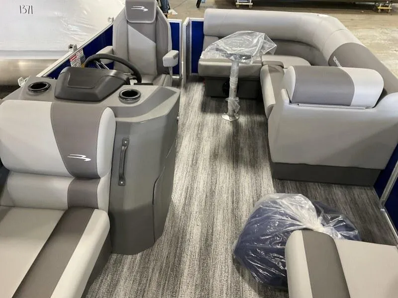 Slide: The Image of 2025 Bennington 168 SL pontoon boat interior with gray seating and steering console. - 30