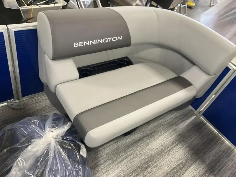 Slide: The Image of 2025 Bennington 168 SL boat seat in gray and white, featuring cup holders. - 31